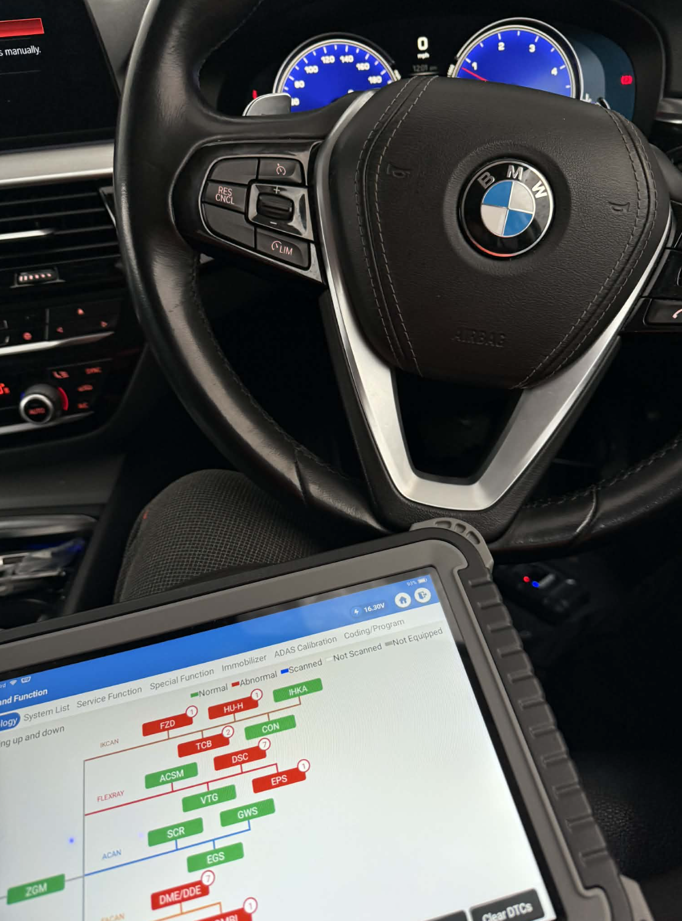 BMW diagnostics with Topdon system scan showing vehicle modules